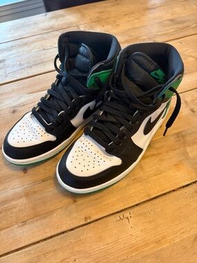 Jordan 1 Black White Green High-Top Sneakers, Mens size 8
Women’s size 9.5